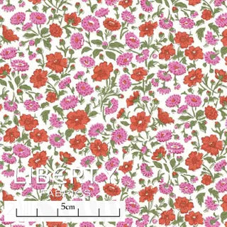 liberty print with red and pink flowers on green stems on a white background